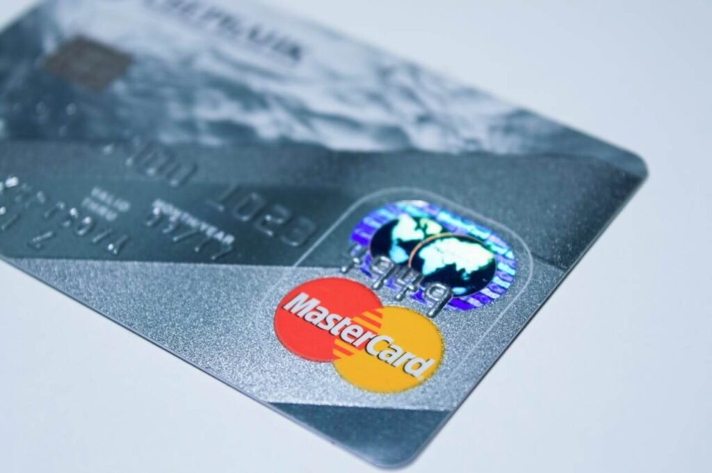 Close-up of a silver Mastercard credit card with logo.